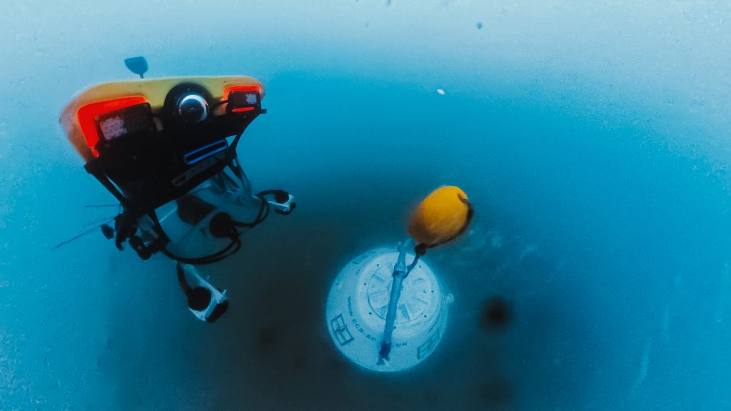 ROV underwater next to a mooring buoy during trials