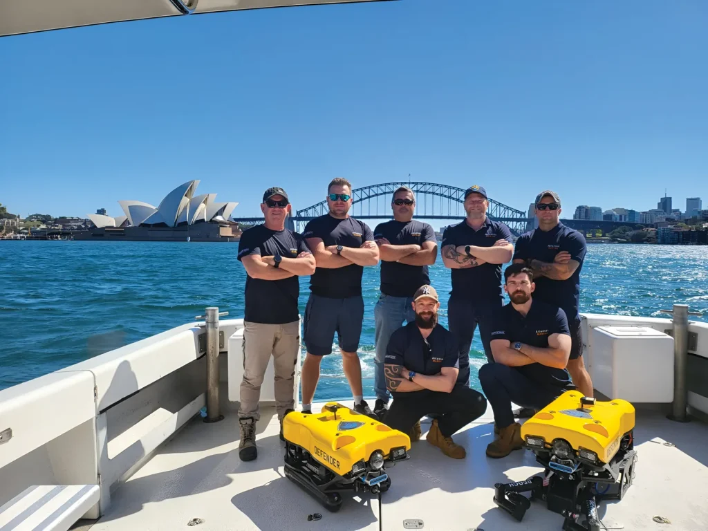 The Atlantas Marine team with two ROVs on a boat in Sydney Harbour