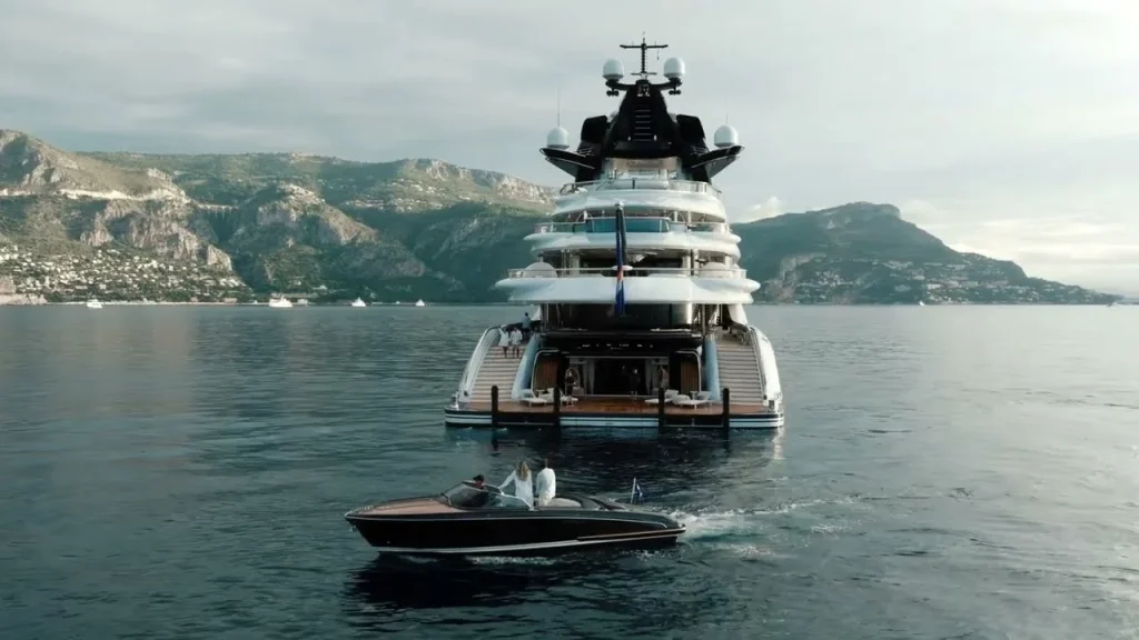 Aerial view of a yacht and its tender on the coast
