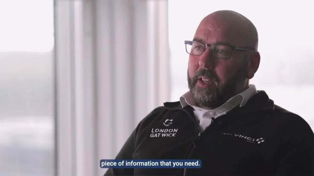 Interview film still with subtitles