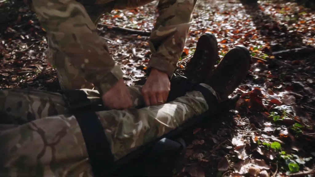 Straps being secured on the CQC stretcher