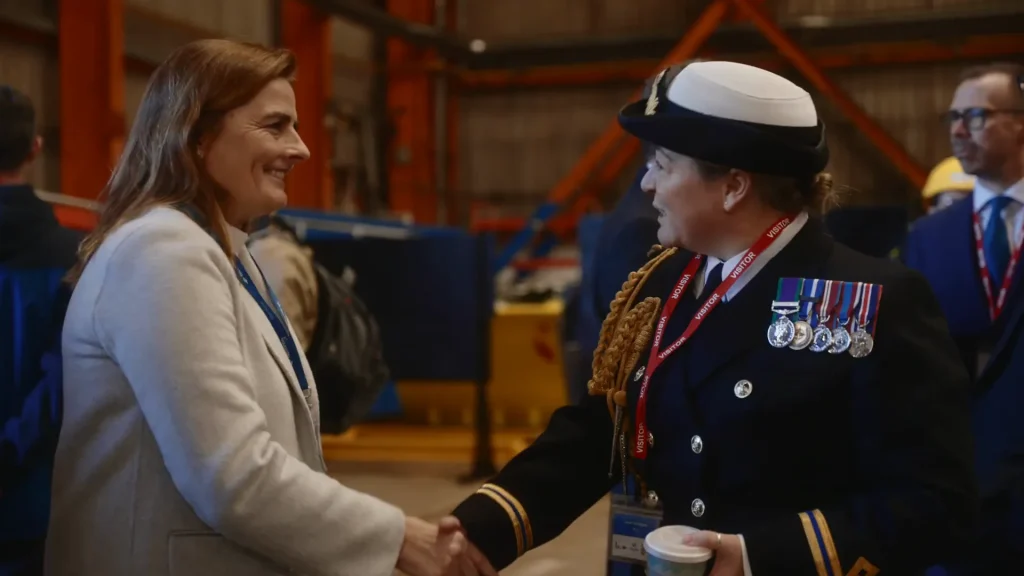 Naval officer greeting a guest at the ceremony