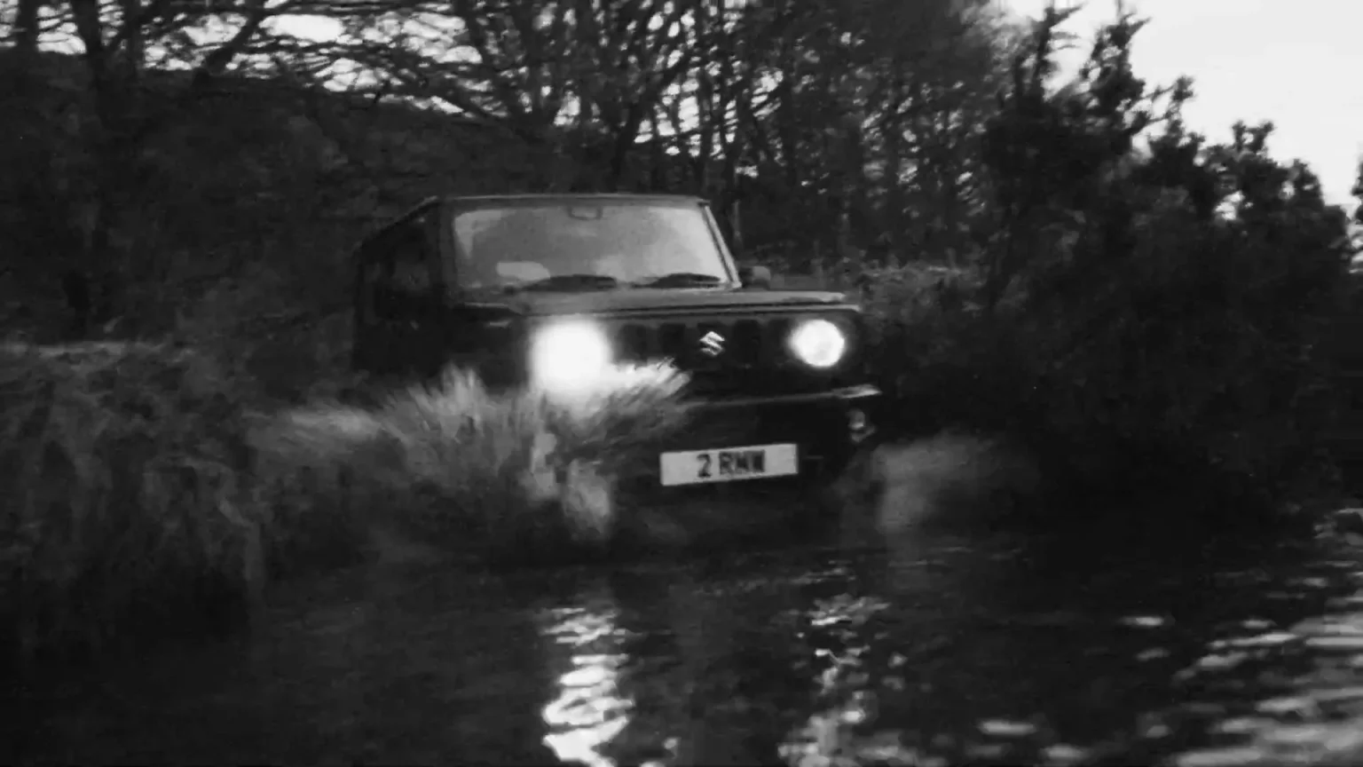 Suzuki Jimny crossing a stream