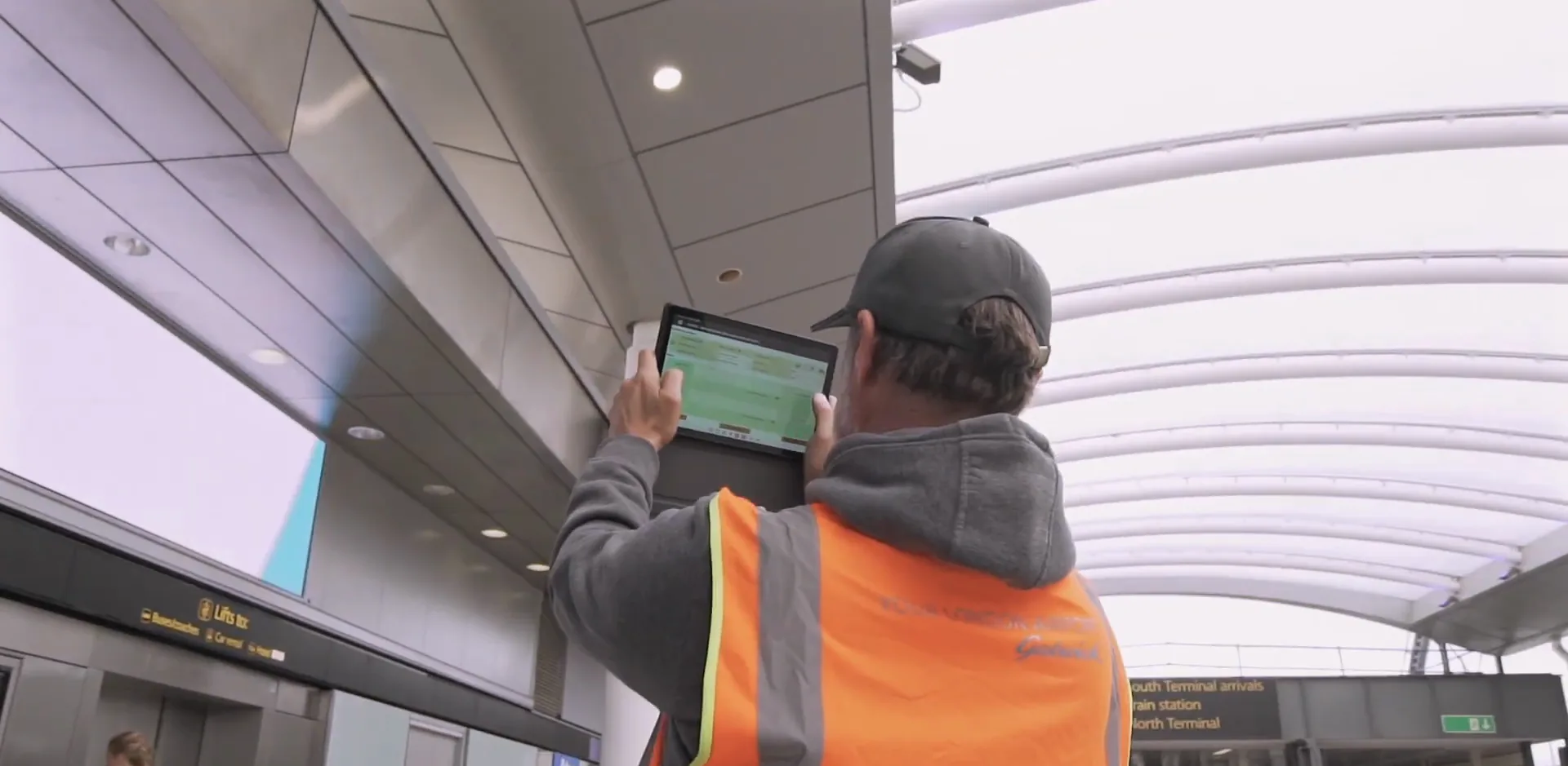 Gatwick team member using the TEAMS app on a tablet in the terminal